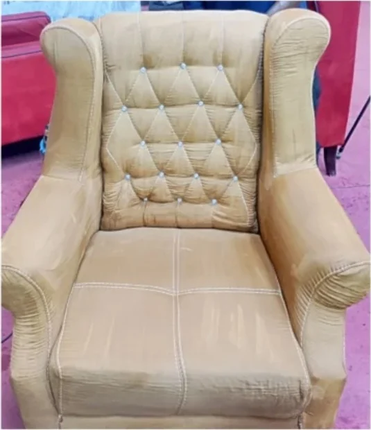 A tan wingback chair after an Ewaso upholstery clean