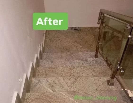 The same staircase after cleaning, granite steps clean and bright